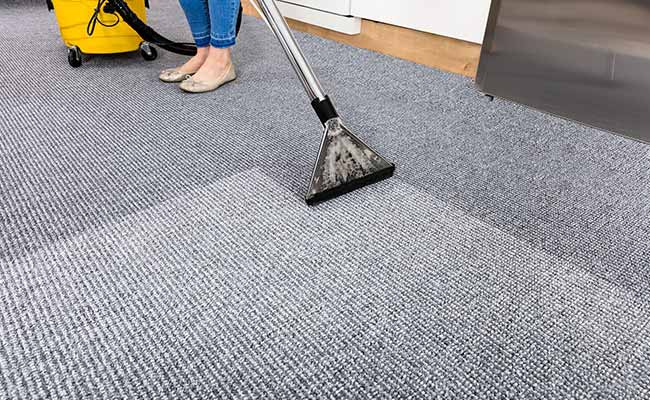 Vacuuming the carpet