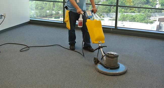 scrubbing the top of the carpet